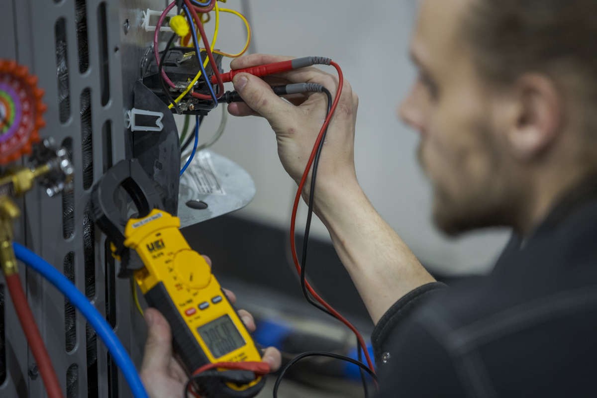 HVAC Student Tests Equipment in Denver, CO