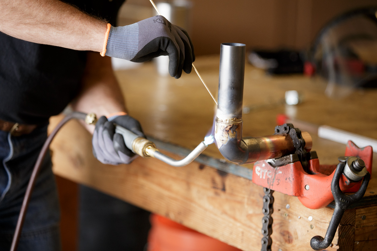 Plumbing Apprenticeship student practices soldering pipes