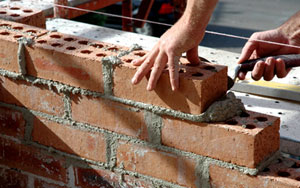 Stock image - bricks being stacked
