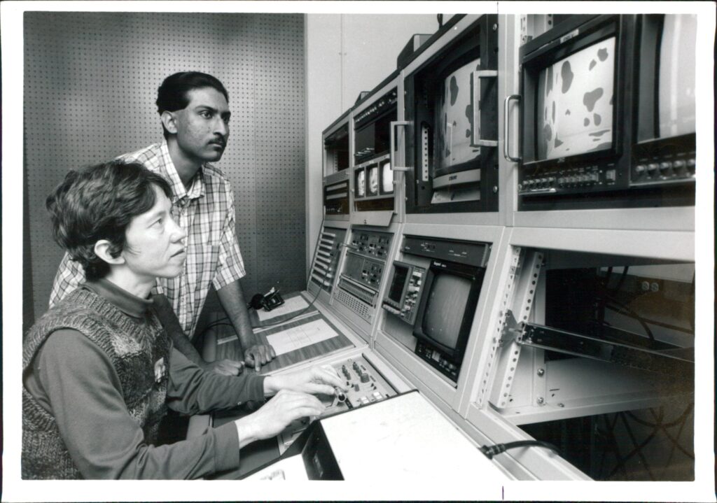 Historical photo - Video Production students watch and edit footage in Denver, CO