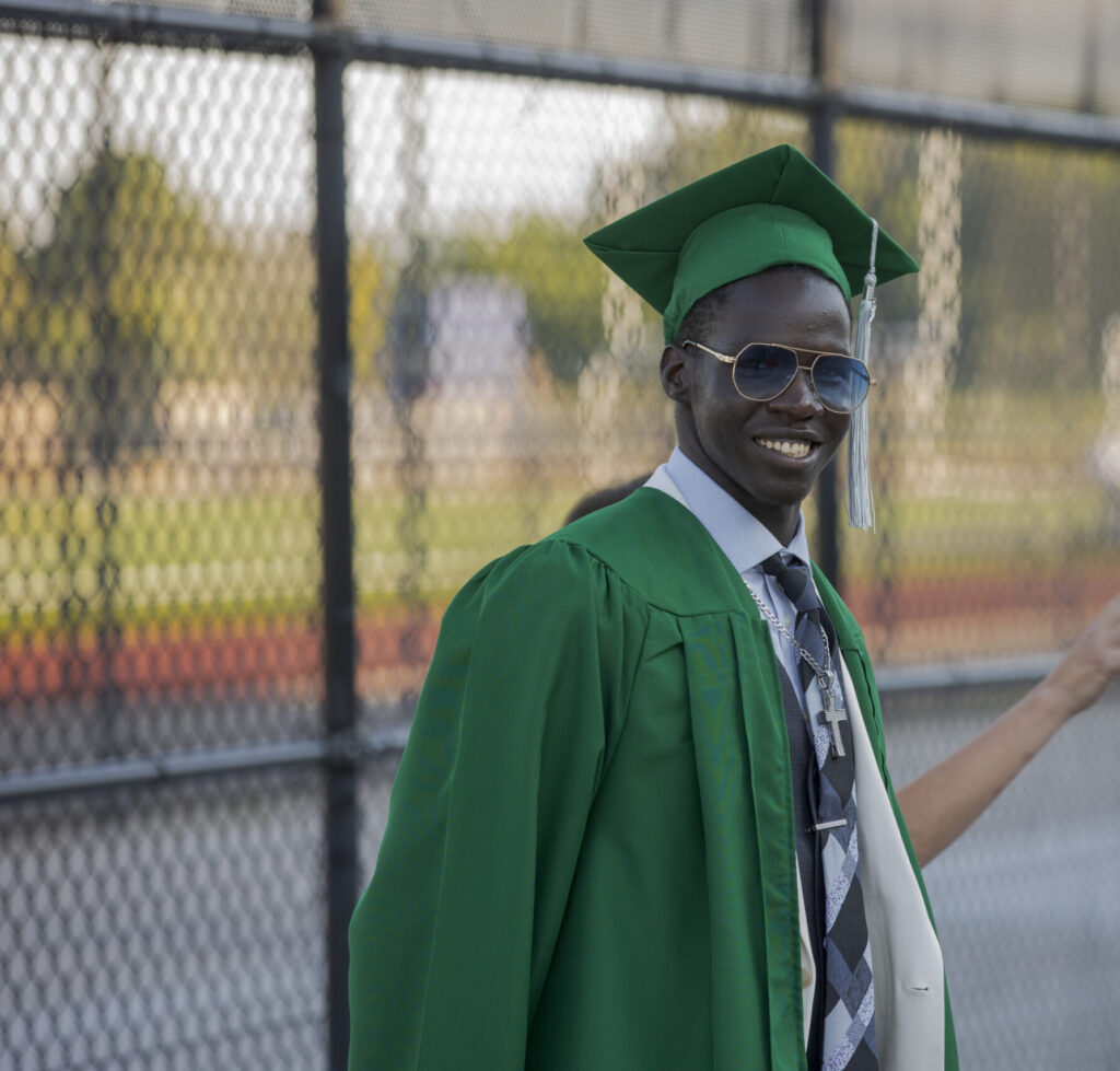 Graduate smiling directly at the camera