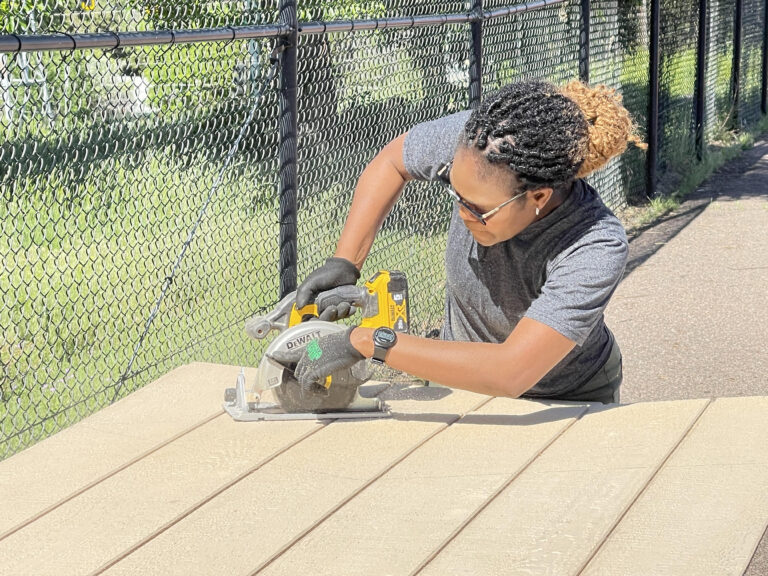 Construction Pre-Apprenticeship Student Cutting Siding with circular saw