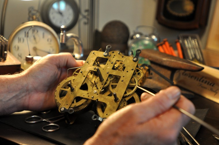 Close up image of gears inside of a clock