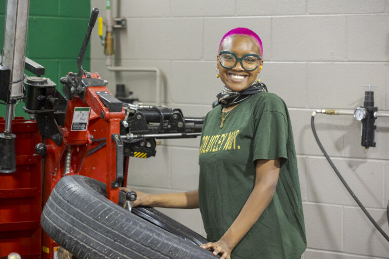 Automotive Service student working on tire