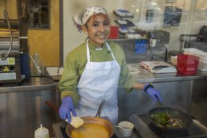Culinary Arts student making omelette