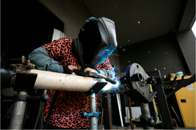 Emily Griffith Technical College student Hayli Klatt welds a pipe in a classroom at the school's Osage Street facility in Denver. Sept. 14, 2026.