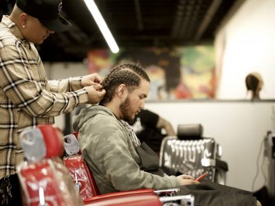 Barbering Student Performing Haircut in Denver, CO