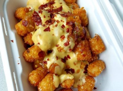 Loaded tater tots (tots, bacon, cheese, and green chile) from Emily's Cafe
